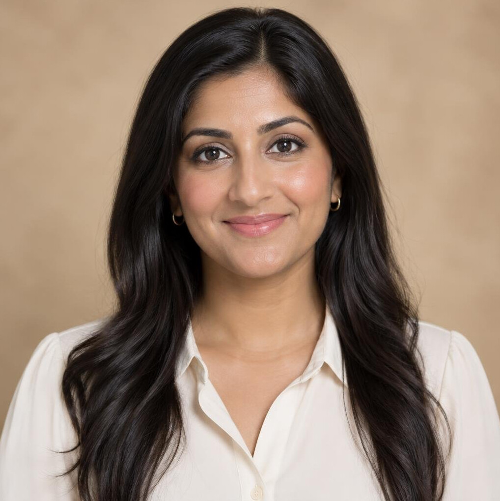 Portrait of a young South Asian woman with dark hair in a light blouse